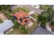 Aerial view showing house, backyard patio, and solar panels at 2790 Pinellas Point S Dr, St Petersburg, FL 33712