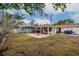 Spacious backyard with covered patio, fire pit, and gazebo at 2790 Pinellas Point S Dr, St Petersburg, FL 33712