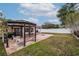 Large backyard with gazebo, patio, and grassy area at 2790 Pinellas Point S Dr, St Petersburg, FL 33712