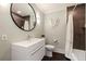 Modern bathroom with floating vanity, large mirror, and shower at 2790 Pinellas Point S Dr, St Petersburg, FL 33712