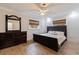 Bedroom with dark wood dresser and king-size bed at 2790 Pinellas Point S Dr, St Petersburg, FL 33712