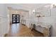 Spacious entryway, showcasing herringbone floors and wainscoting at 2790 Pinellas Point S Dr, St Petersburg, FL 33712