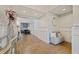Bright entryway with herringbone flooring and built-in bench seating at 2790 Pinellas Point S Dr, St Petersburg, FL 33712