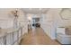 Bright and airy foyer with herringbone floors and wainscoting at 2790 Pinellas Point S Dr, St Petersburg, FL 33712