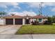 Attractive two-car garage and front entry at 2790 Pinellas Point S Dr, St Petersburg, FL 33712