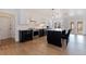 Modern kitchen features white and dark cabinetry, quartz countertops, and stainless steel appliances at 2790 Pinellas Point S Dr, St Petersburg, FL 33712