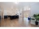 Open concept kitchen and living area with hardwood flooring and island at 2790 Pinellas Point S Dr, St Petersburg, FL 33712