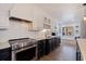Modern kitchen features stainless steel appliances and white and dark cabinetry at 2790 Pinellas Point S Dr, St Petersburg, FL 33712