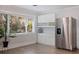 Well-equipped kitchen with ample cabinet space and stainless steel refrigerator at 2790 Pinellas Point S Dr, St Petersburg, FL 33712