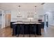 Eat-in kitchen with a large island, white and dark cabinetry, and quartz countertops at 2790 Pinellas Point S Dr, St Petersburg, FL 33712