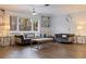 Bright living room with hardwood floors, comfortable seating, and large windows at 2790 Pinellas Point S Dr, St Petersburg, FL 33712