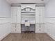 Home office with built-in cabinetry and hardwood floors at 2790 Pinellas Point S Dr, St Petersburg, FL 33712