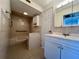 Updated bathroom with walk-in shower and modern vanity at 2991 Flint S Dr # 77-D, Clearwater, FL 33759