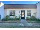 Inviting condo exterior with well-manicured landscaping and a private entrance at 2991 Flint S Dr # 77-D, Clearwater, FL 33759