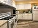 Well-equipped kitchen featuring modern appliances and cabinetry at 2991 Flint S Dr # 77-D, Clearwater, FL 33759