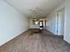 Open living room with a view of the kitchen and access to other rooms at 2991 Flint S Dr # 77-D, Clearwater, FL 33759