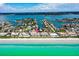 Aerial view showcasing beachfront location and community at 3100 Gulf Blvd # 424, Belleair Beach, FL 33786