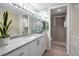 Double vanity bathroom with shower and granite countertops at 3100 Gulf Blvd # 424, Belleair Beach, FL 33786