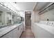 Bathroom with granite countertops and laundry area at 3100 Gulf Blvd # 424, Belleair Beach, FL 33786