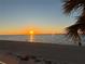 Stunning sunset view over a tranquil beach at 3100 Gulf Blvd # 424, Belleair Beach, FL 33786