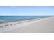 Expansive beachfront view with calm ocean waves at 3100 Gulf Blvd # 424, Belleair Beach, FL 33786
