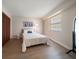 Guest bedroom with wood floors and plenty of natural light at 3100 Gulf Blvd # 424, Belleair Beach, FL 33786