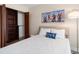 Bedroom with built-in shelving and beachy decor at 3100 Gulf Blvd # 424, Belleair Beach, FL 33786