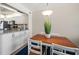 Open concept dining area with kitchen view and plant decor at 3100 Gulf Blvd # 424, Belleair Beach, FL 33786