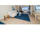 Living room boasts ocean view and comfortable seating at 3100 Gulf Blvd # 424, Belleair Beach, FL 33786