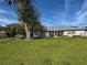 Spacious backyard with lake access and privacy at 3922 Lake Joyce Dr, Land O Lakes, FL 34639