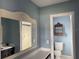 Bathroom with vanity, toilet, and shower at 3922 Lake Joyce Dr, Land O Lakes, FL 34639