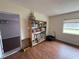 Bright bedroom with hardwood floors and bookcase at 3922 Lake Joyce Dr, Land O Lakes, FL 34639