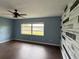 Bedroom with lake view and accent wall at 3922 Lake Joyce Dr, Land O Lakes, FL 34639