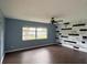 Bedroom with lake view, wood-like floors and accent wall at 3922 Lake Joyce Dr, Land O Lakes, FL 34639