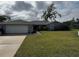 Single story home with attached garage and well-maintained lawn at 3922 Lake Joyce Dr, Land O Lakes, FL 34639