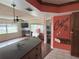 Kitchen with granite countertop and view of living room at 3922 Lake Joyce Dr, Land O Lakes, FL 34639