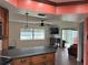 Kitchen with granite countertop and lake view at 3922 Lake Joyce Dr, Land O Lakes, FL 34639