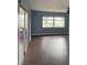 Living room with sliding doors to patio and water view at 3922 Lake Joyce Dr, Land O Lakes, FL 34639