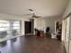 Living room with hardwood floors and access to other rooms at 3922 Lake Joyce Dr, Land O Lakes, FL 34639