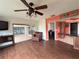 Bright living room with hardwood floors and sliding glass doors at 3922 Lake Joyce Dr, Land O Lakes, FL 34639