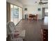 Living room with sliding doors and hardwood floors at 3922 Lake Joyce Dr, Land O Lakes, FL 34639