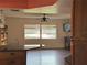 Living room with lake view and hardwood floors at 3922 Lake Joyce Dr, Land O Lakes, FL 34639