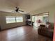 Living room with lake view and sliding doors at 3922 Lake Joyce Dr, Land O Lakes, FL 34639