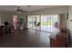 Living room with hardwood floors and sliding glass doors at 3922 Lake Joyce Dr, Land O Lakes, FL 34639