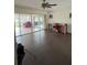 Living room with dark hardwood floors and sliding glass doors at 3922 Lake Joyce Dr, Land O Lakes, FL 34639