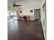 Living room with dark hardwood floors and sliding glass doors at 3922 Lake Joyce Dr, Land O Lakes, FL 34639