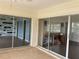 Screened porch with view of backyard and lake at 3922 Lake Joyce Dr, Land O Lakes, FL 34639