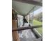View of a screened porch with backyard access at 3922 Lake Joyce Dr, Land O Lakes, FL 34639