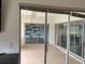 Bright sunroom with tiled flooring at 3922 Lake Joyce Dr, Land O Lakes, FL 34639