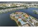 Aerial view of homes on peninsula showcasing lakeside living and neighborhood layout from above at 407 Blackhawk Cir, Sun City Center, FL 33573